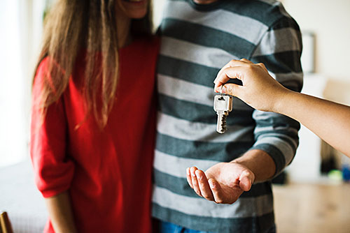 First time buyers receiving new house keys
